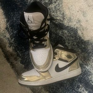 White gold and black Air Jordan’s